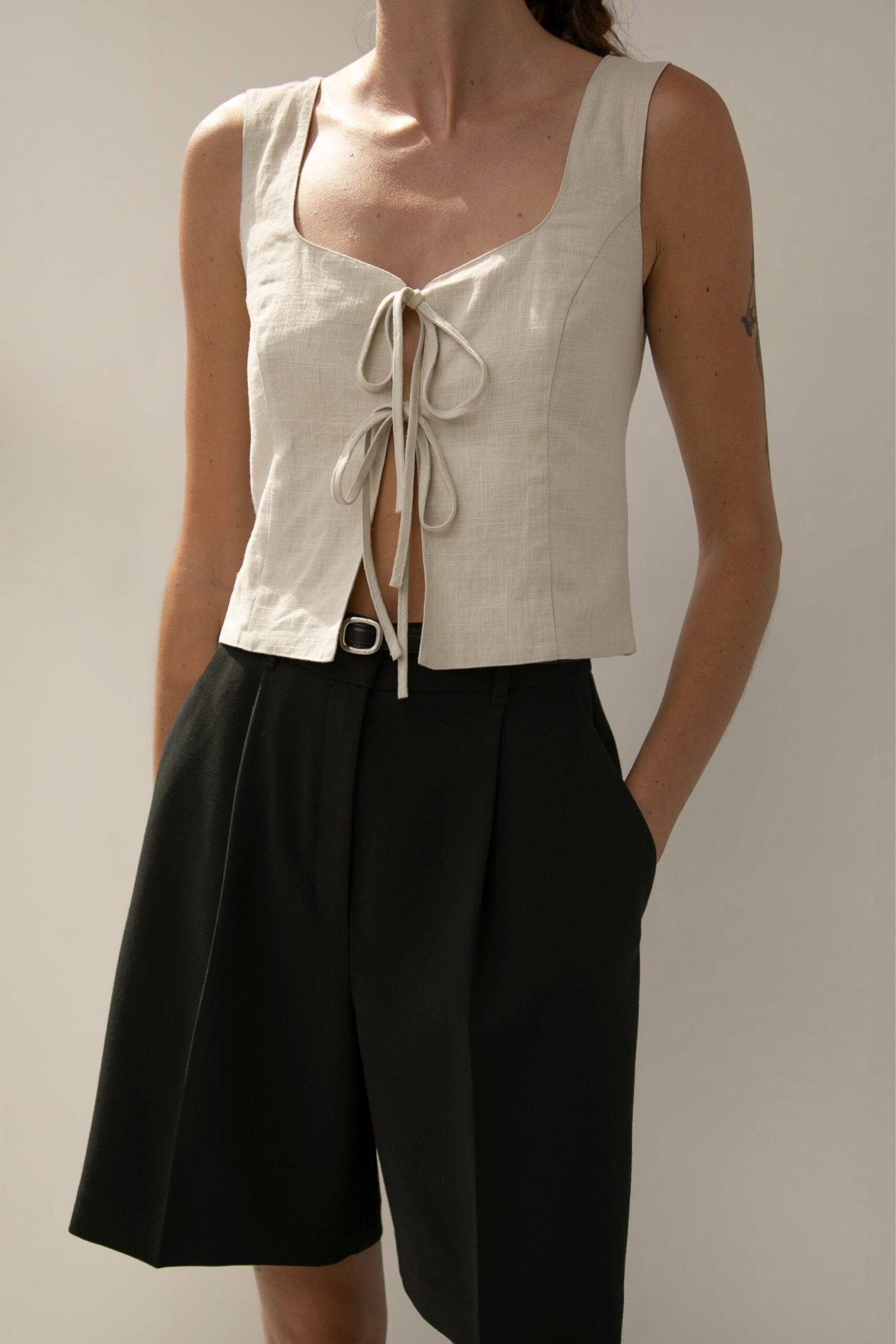 Blouse-12570_Seashell-1.jpg Linen Blend Tie Front Tank Top - Image 1