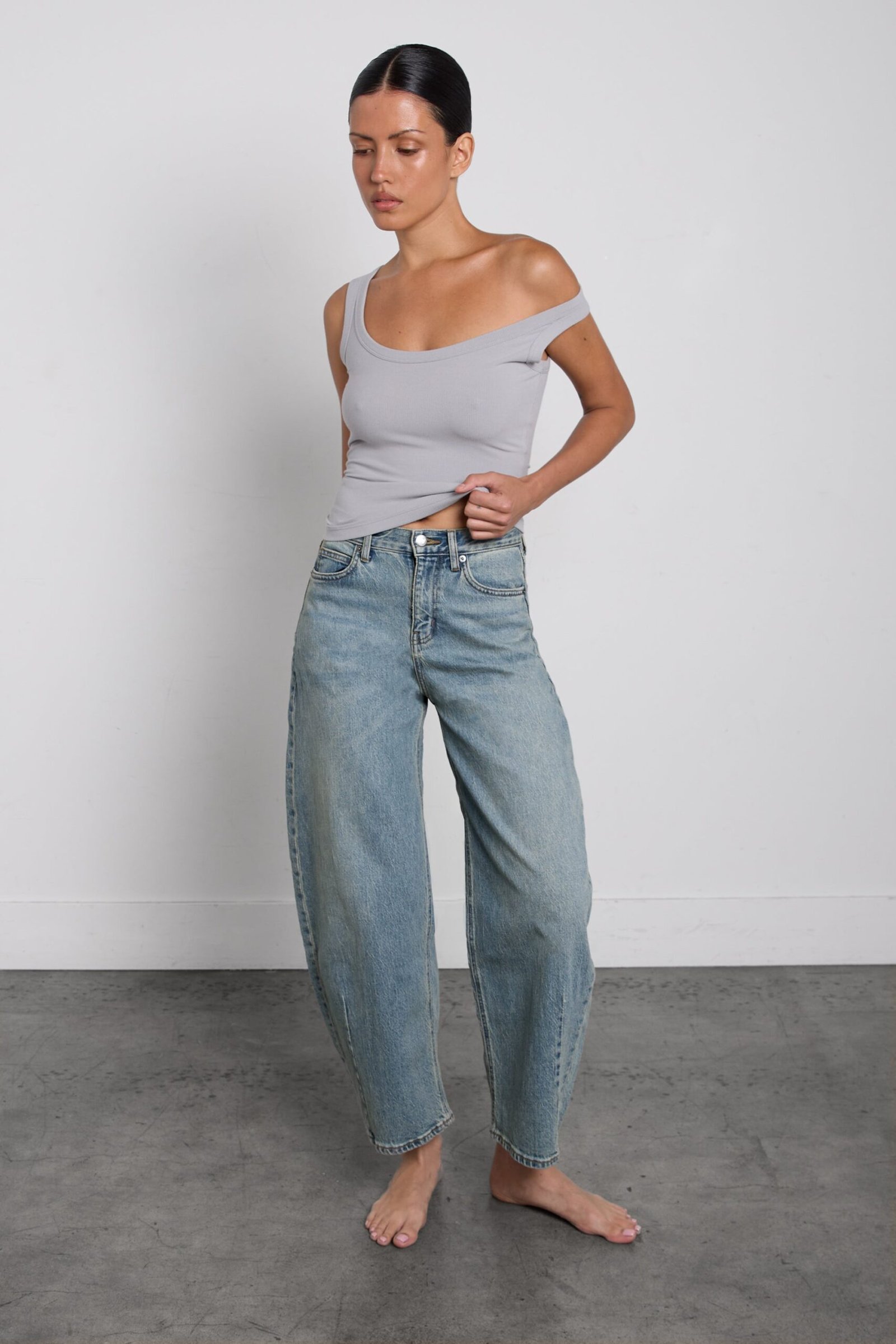 Denim-14235_Green_Cast_Medium_Wash-1.jpg Mid-Rise Darted Barrel Leg Jean - Image 1