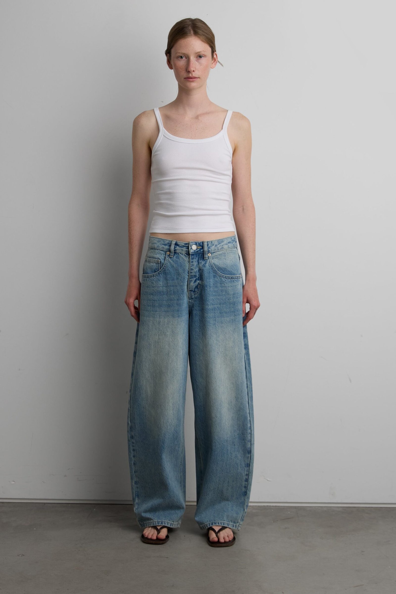 Denim-15536_Medium_Wash-1_1d0c7b00-f626-433c-8c9c-8c49712c64dd.jpg 27" CURVE LEG MID RISE DENIM JEAN - Image 1
