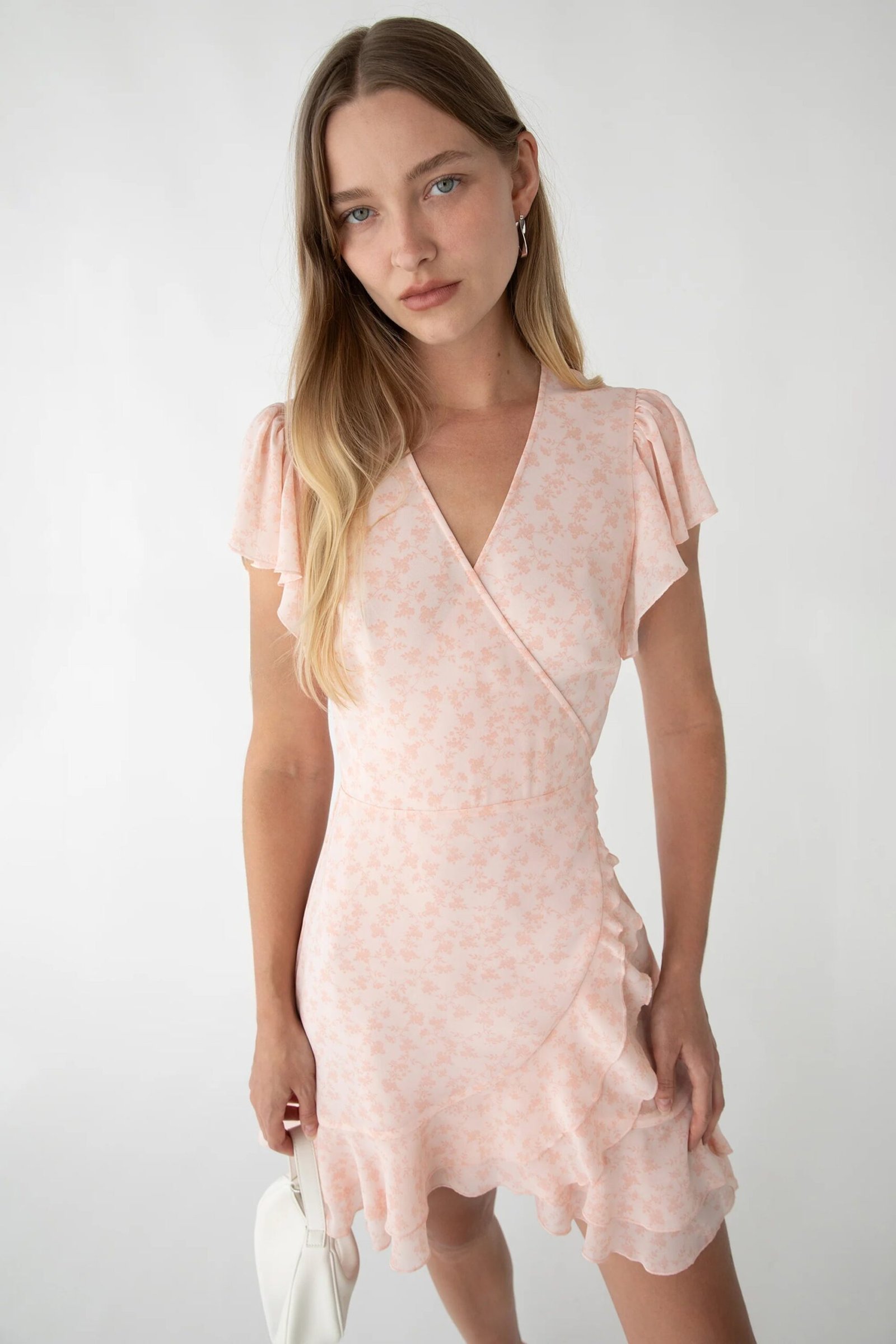 Dress-13560_Light_Rose_Floral-1.jpg Floral Wrap Mini Dress With Ruffled Hem - Image 1