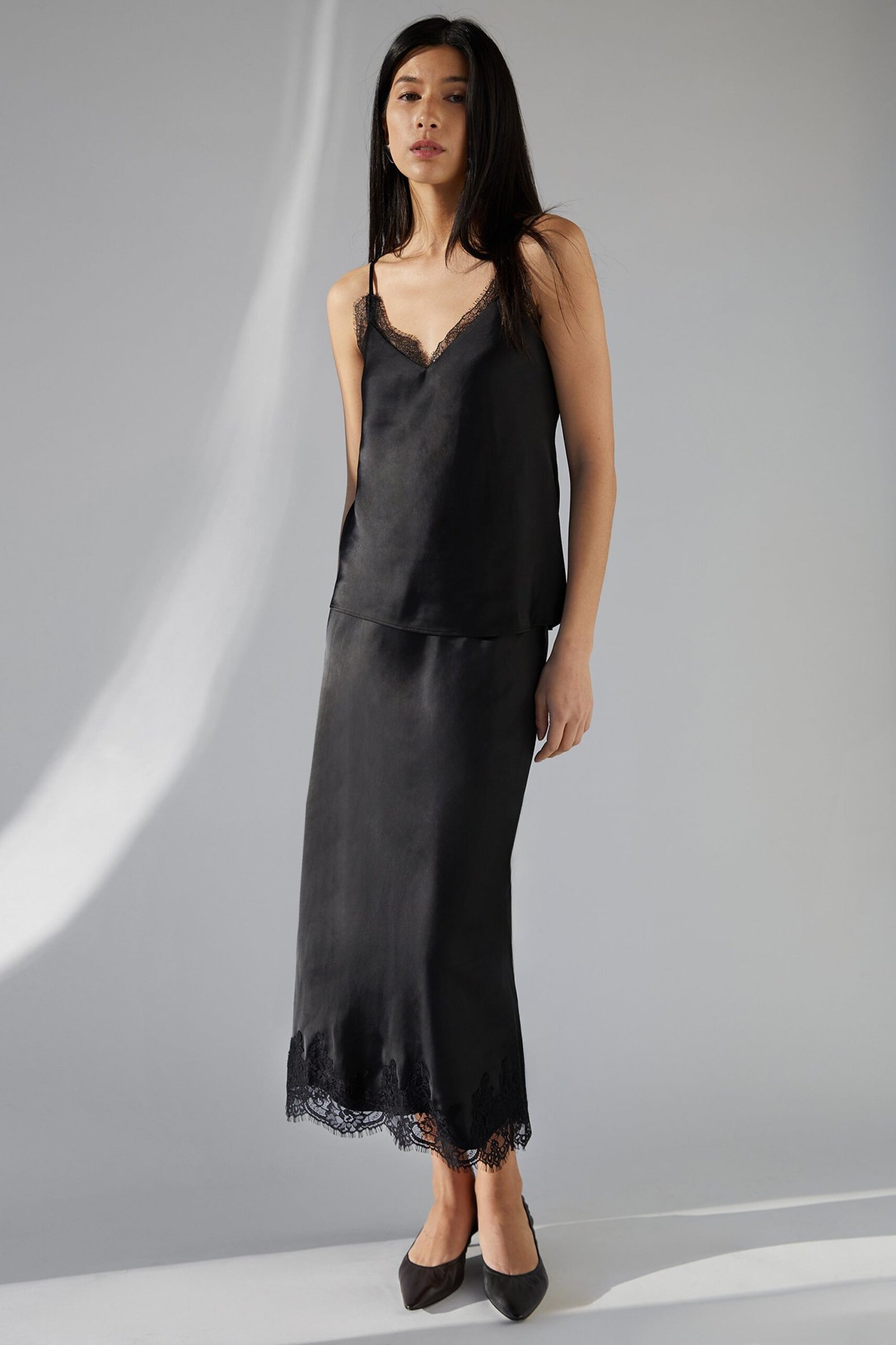 Skirt-13628_Black-1.jpg Lace Trim Satin Midi Skirt - Image 1